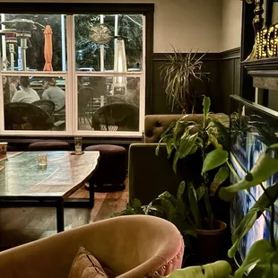 a living room with couches and tables