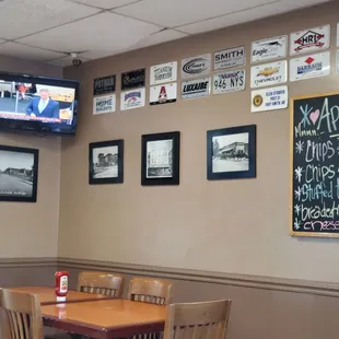 a dining area with a television and a table