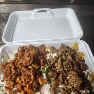 Mix chilaquiles with asada and season Pork