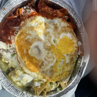 My chilaquiles, over hard eggs with no meat and red and green sauce.