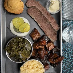 Two meat plate w/ collards Mac and Cheese.