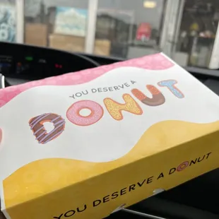 a box of donuts in a car