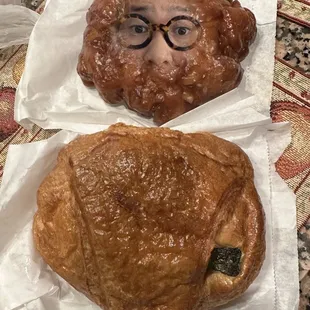 a woman&apos;s face and a croissant