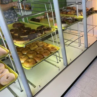 a display case filled with various types of donuts