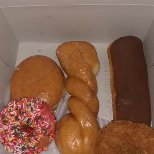 Glazed raspberry filled, strawberry sprinkle, glazed twist, chocolate bar, cinnamon crunch