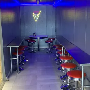 a long line of stools and tables