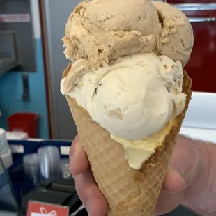 Double scoop with caramel collision, barking pretzel, and vanilla in a homemade waffle cone