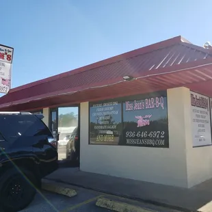 a car parked in front of the store