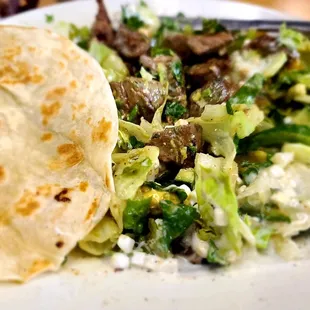 Steak Salad mixed with homemade flour tortilla