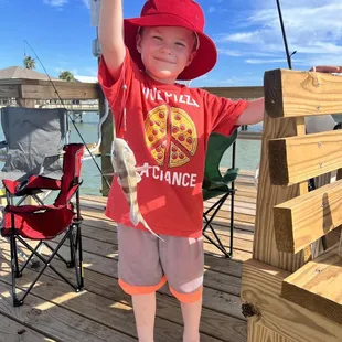 Our little guy showing off his catch.  He sent this guy home to be with his mommy and daddy!