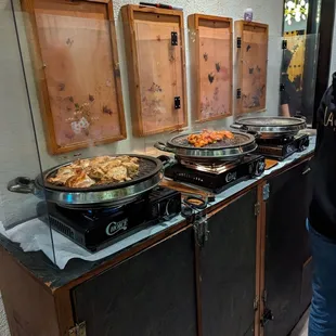 a woman standing in front of a buffet