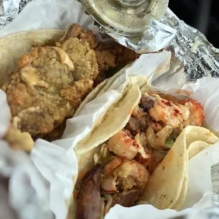 Softshell crab taco and jambalaya taco with cucumber salad