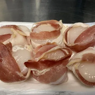 We use real pork bacon to wrap our fresh off the boat sea scallops with.
