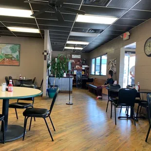 a restaurant with tables and chairs