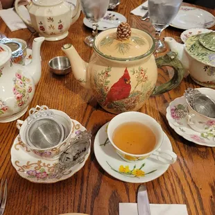 a table with tea and teapots