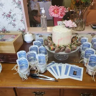 a table with a cake and tea bags