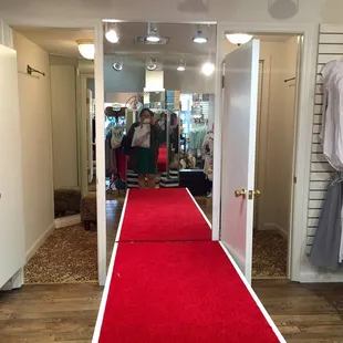 Omg they have a red carpet runway by the dressing room! How cute!