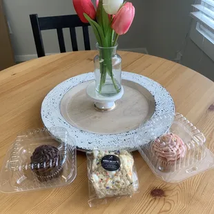 a vase of tulips on a table