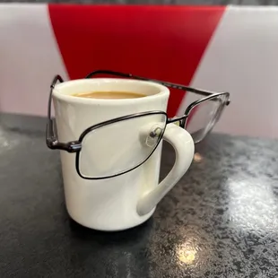 a cup of coffee and glasses