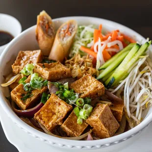 Stir Fried Tofu Vermicelli Bowl - fresh lettuce, mint, basil, cucumber, pickled daikon and carrots, bean sprouts, and roasted peanuts