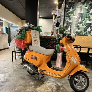 cute scooter when you first walk in decorated for the holidays