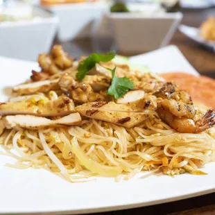 a plate of noodles and shrimp