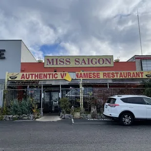 a car parked in front of a restaurant