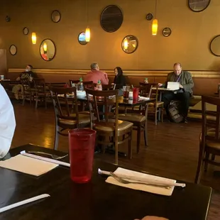 a man sitting at a table in a restaurant