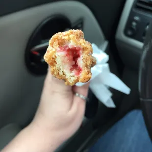 a person holding a donut