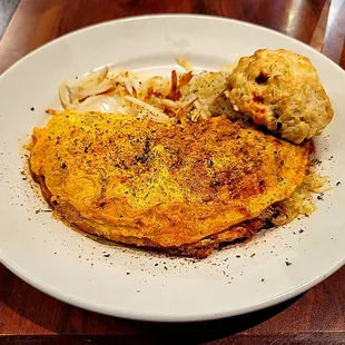 Amy's Bayou Omelet with pimento cheese biscuit and shredded potato &amp; onion hash browns.