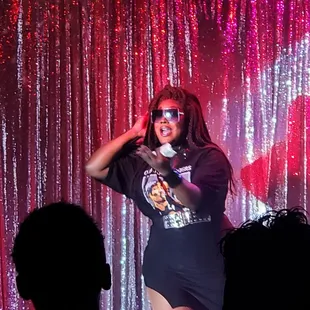 a woman singing on stage