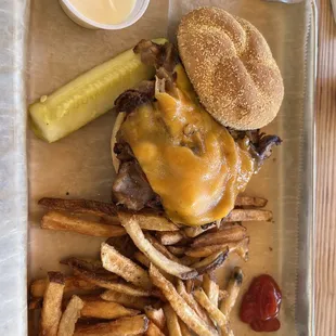 cheeseburger with fries and pickle