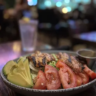 Cesar Salad w Grilled Chicken Breast added tomatoes, avocado,cucumbers and onions.