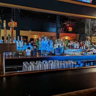 a bar with a variety of liquors