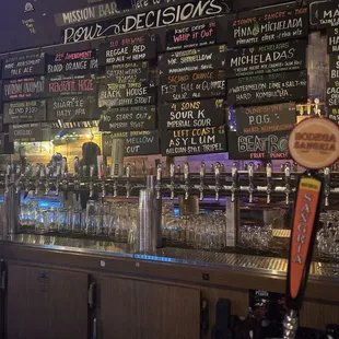 a variety of beers on the bar