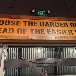 a sign that says choose the harder right instead of the easier wrongs