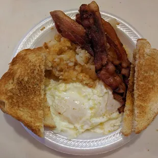 2 egg breakfast with bacon, hash browns and toast