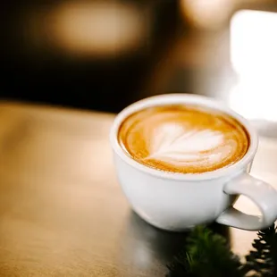 a cup of coffee on a table