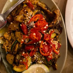 a plate of chicken and vegetables