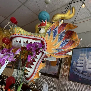 a dragon head hanging from the ceiling