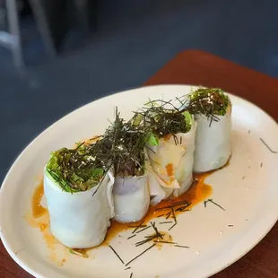 a plate of sushi rolls