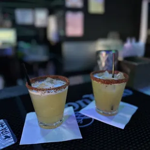 two margaritas on a bar