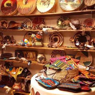 Find a large selection of Native American artifacts including painted drums, fans, knives drums and medicine bags