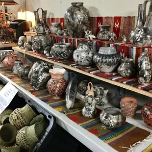 Hundreds of authentic etched Indian Pottery pieces created with real horse hair and hand painted Pueblo pottery.
