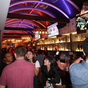 a group of people at a bar