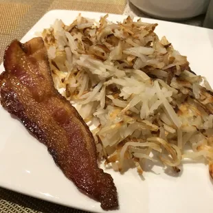 Hash browns and a slice of bacon