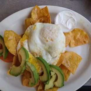 Chilaquiles with avo subbed for carnitas (where's the cheese and sauce???) --still delish tho!