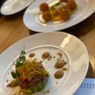 Appetizers: Diced Tuna Tartar and Jumbo Lump Crab Fritters.