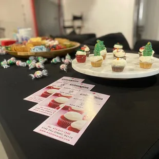 a plate of mini cupcakes on a table