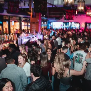 a crowd of people at a bar